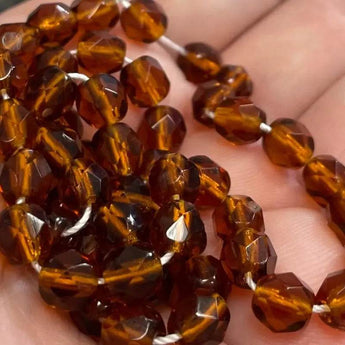 50 Amber Czech Fire Polished Glass Beads, 6mm, translucent topaz with faceted shine.